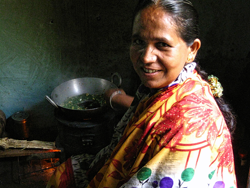 Woman in Paithan India using Envirofit cookstove