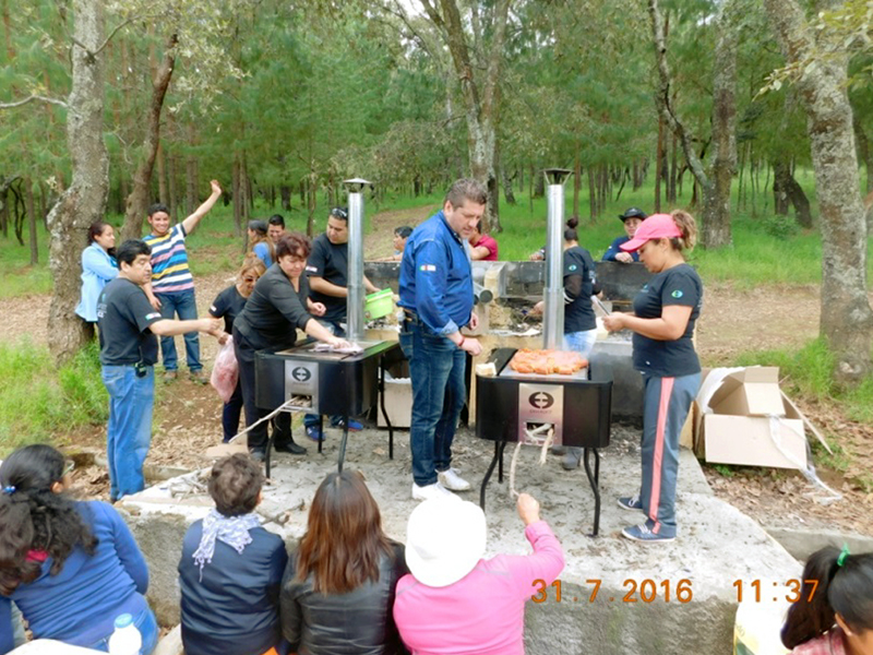 Envirofit employees cook during reforestation project