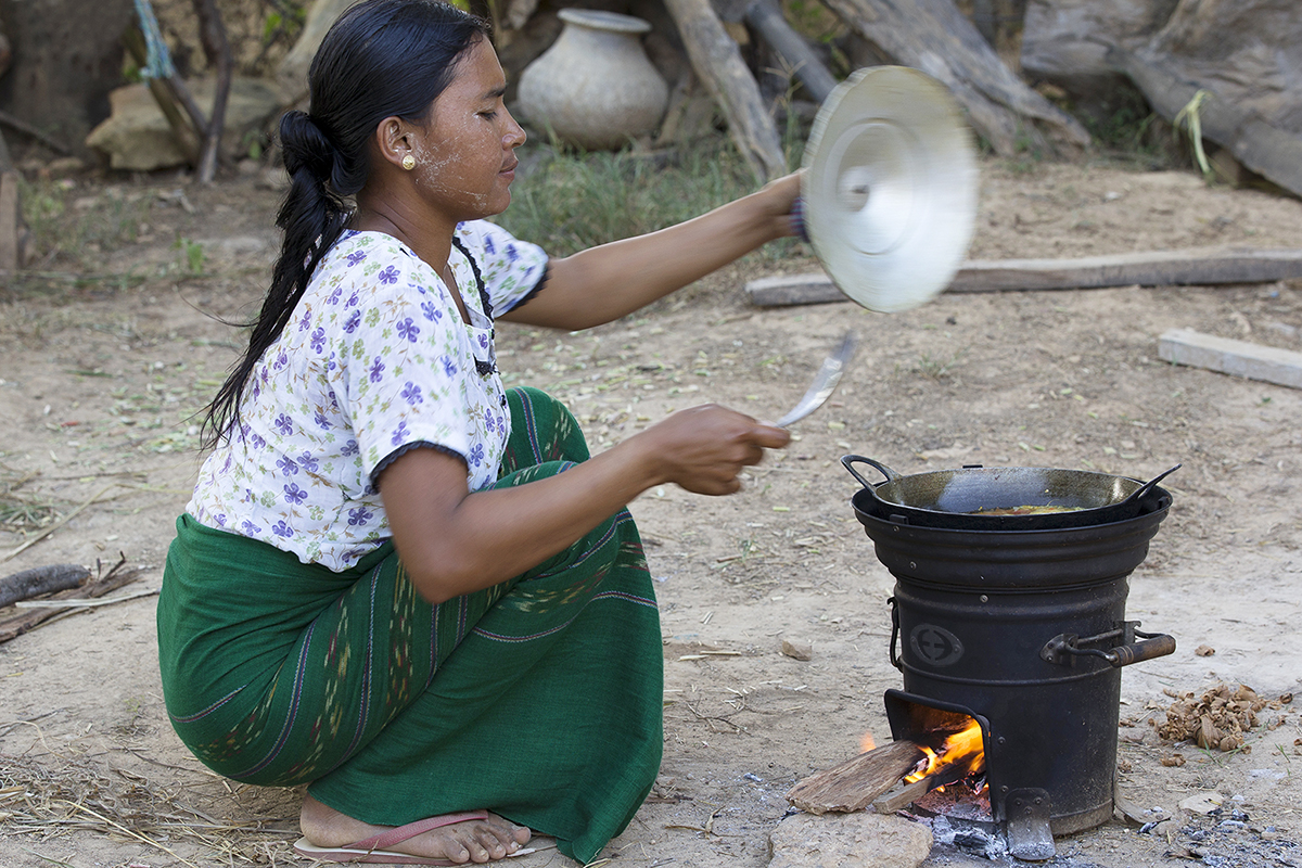 A woman in Myanmars's Dry Zone cooks on an Envirofit SuperSaver wood stove