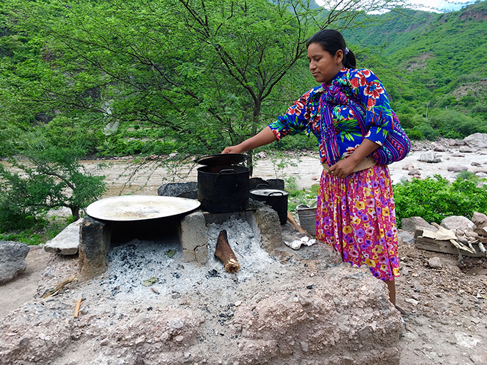 Tarahumara woman cooks with unimproved stove