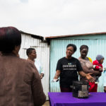 Direct Sales Representative Beatrice Ayoro, speaks about the SuperSaver charcoal stove during a demonstration in Dandora, Kenya